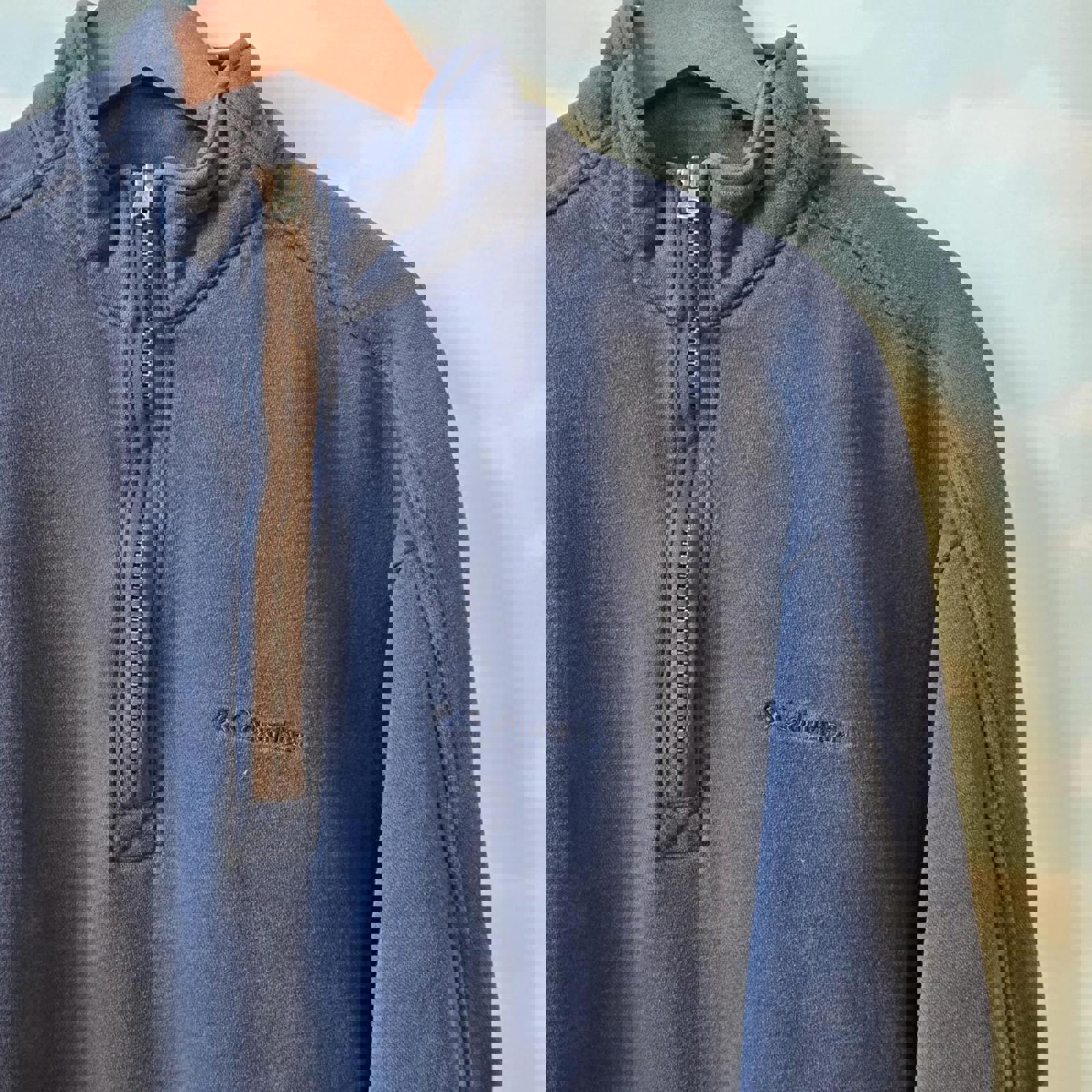 Blue Columbia quarter zip sweatshirt with brown trim