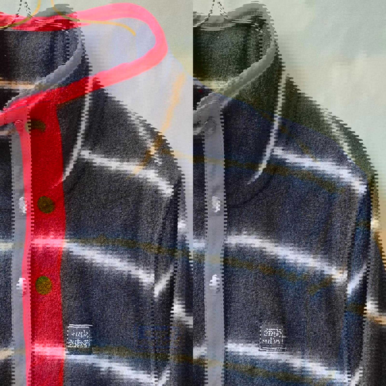 Navy and white striped quarter zip fleece with pink accents