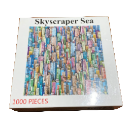 Jigsaw puzzle box with colorful skyscraper design on a wooden surface